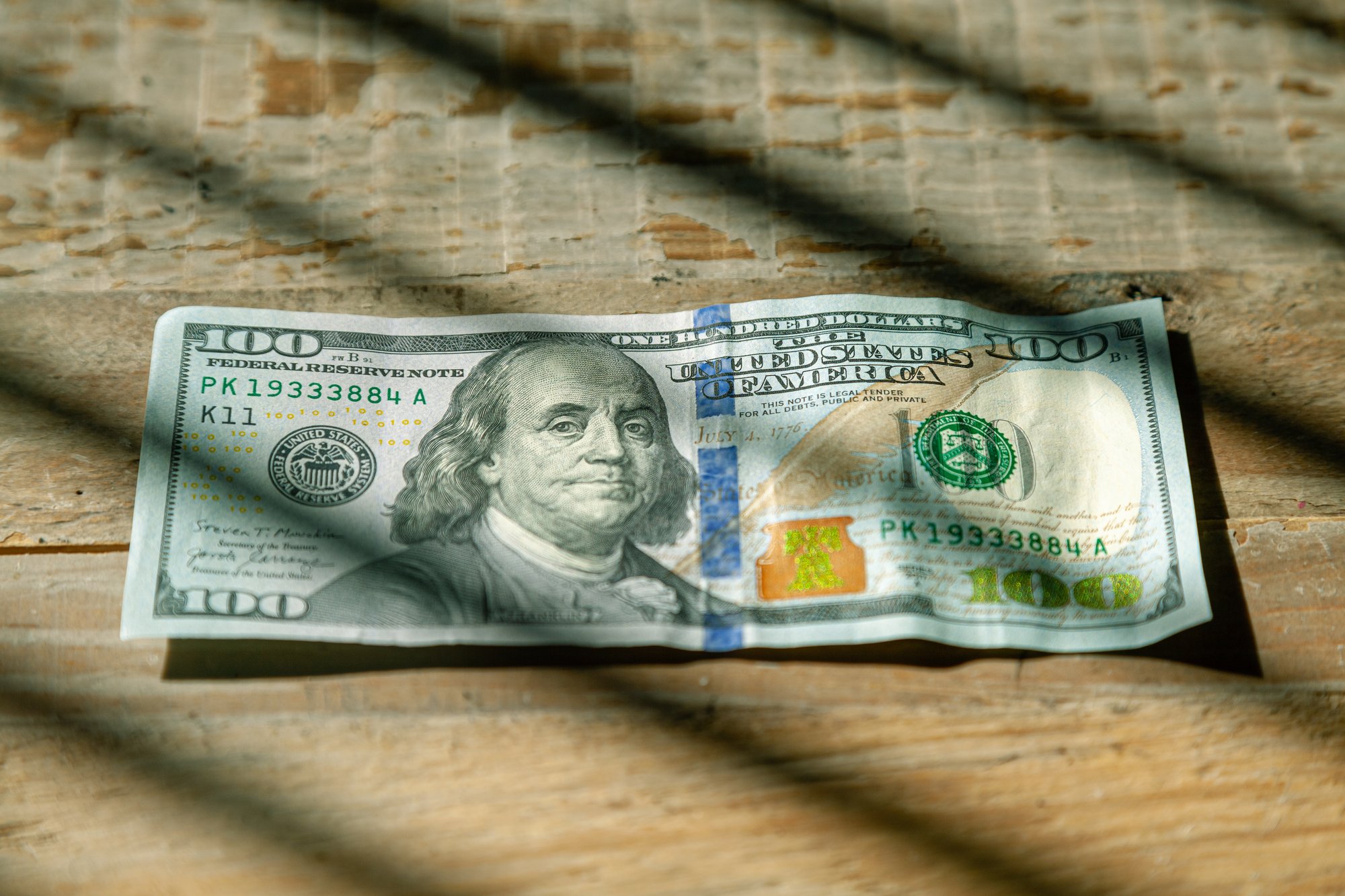 one hundred dollar bill in window shadow live-richer-ryQ-GmDsHhE-unsplash one hundred dollar bill in window shadow live-richer-ryQ-GmDsHhE-unsplash